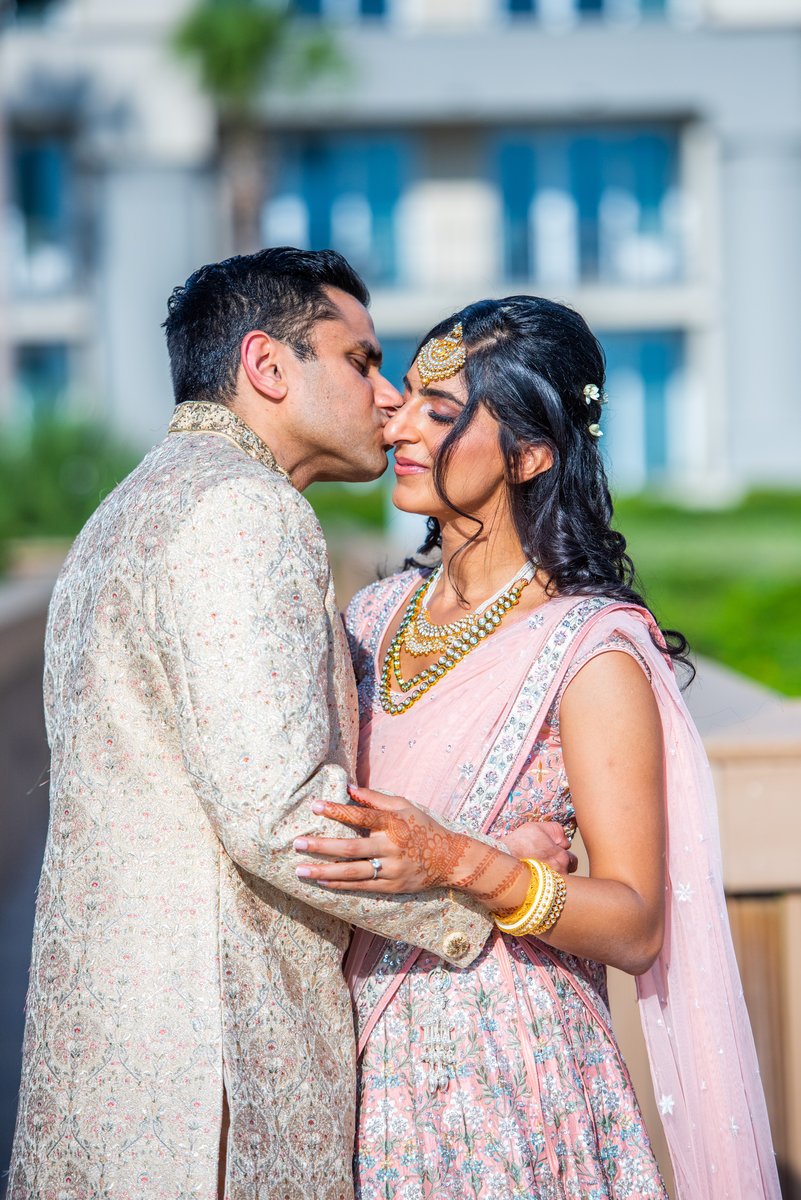 Indian bride and groom portraits in golden light on the beach, Amelia Island wedding