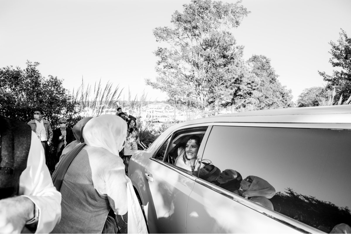 Quiet moment of the newlyweds looking out the limo window after their Maryland wedding